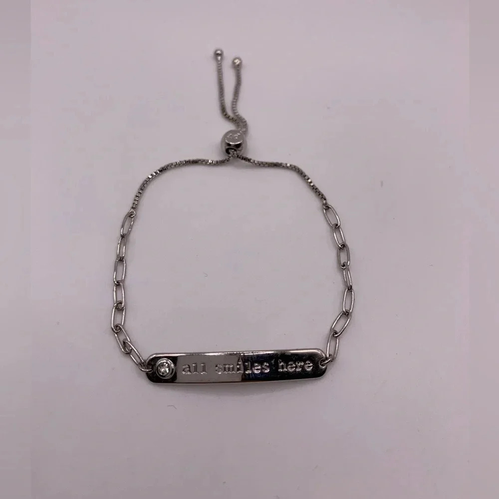 #118 Silver tone “all smile  here” adjustable bracelet